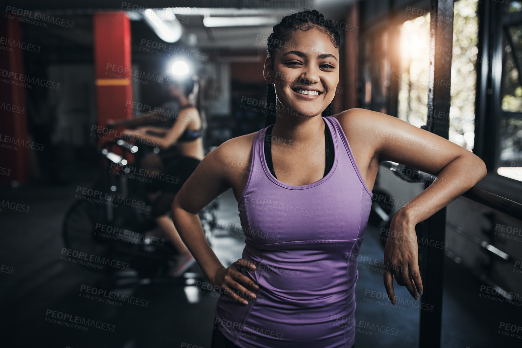 Buy stock photo Shot of a sporty young woman at the gym