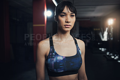 Buy stock photo Shot of a beautiful young woman at the gym for a workout
