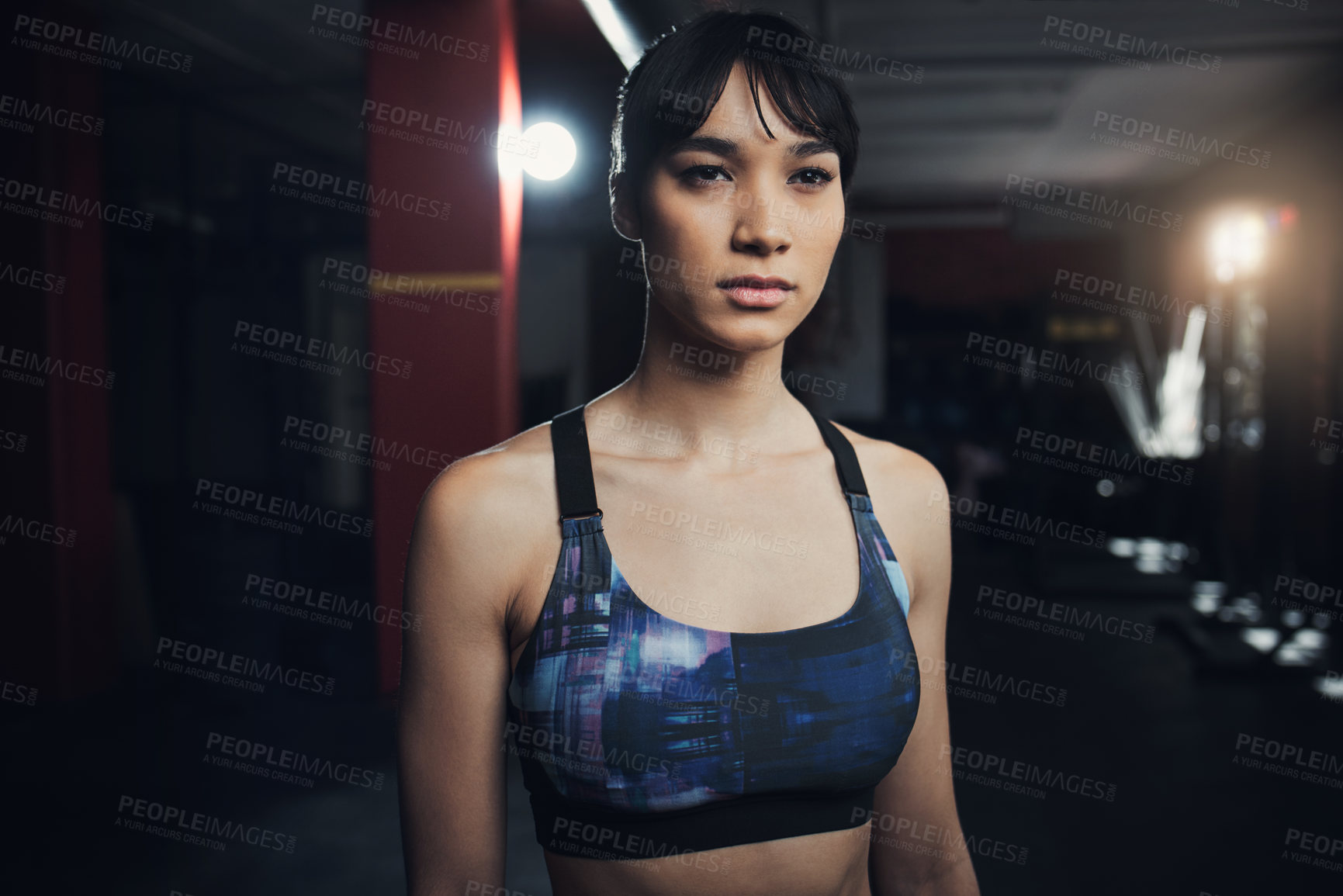 Buy stock photo Shot of a beautiful young woman at the gym for a workout