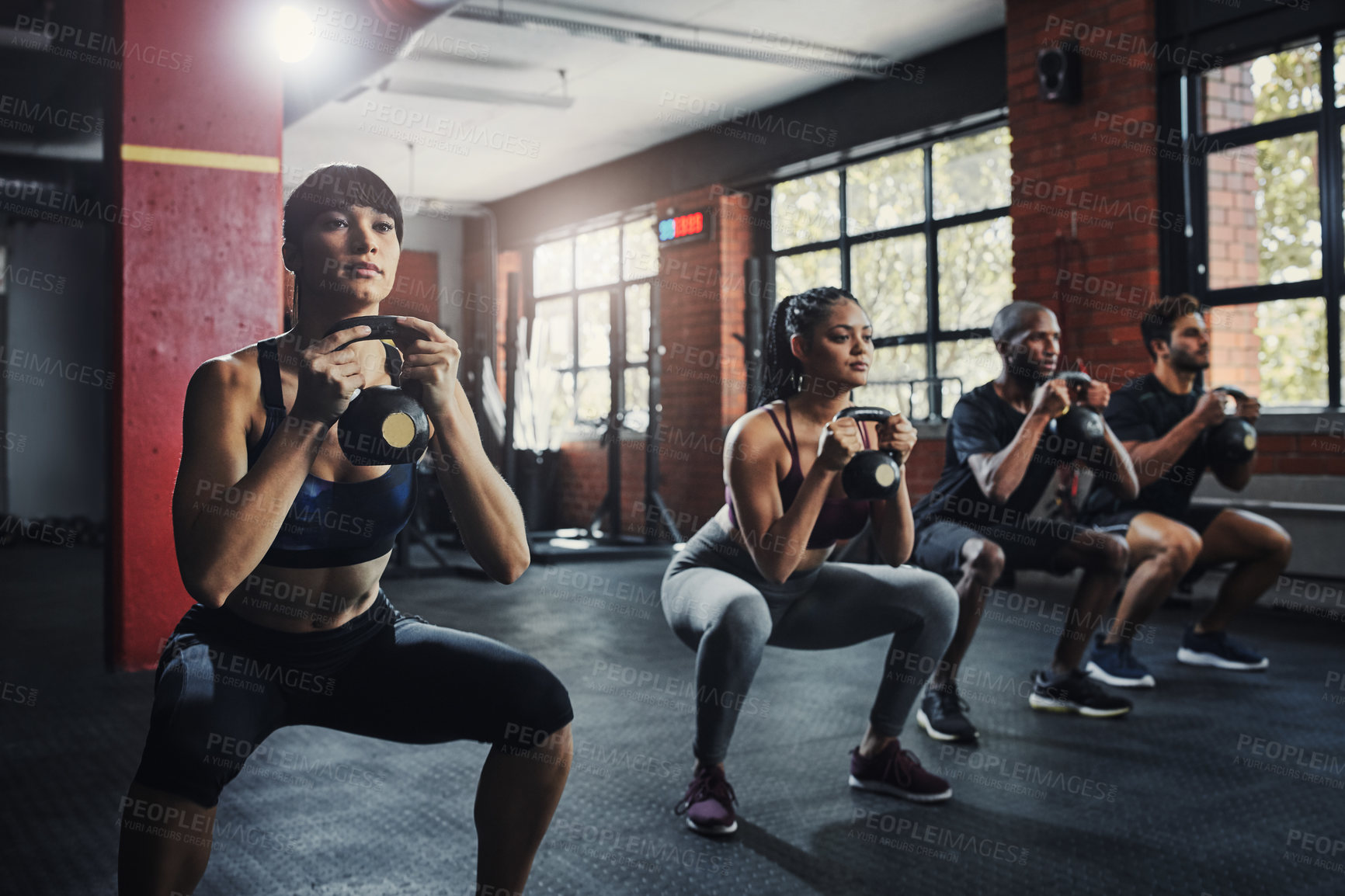 Buy stock photo Shot of a group of people working out together