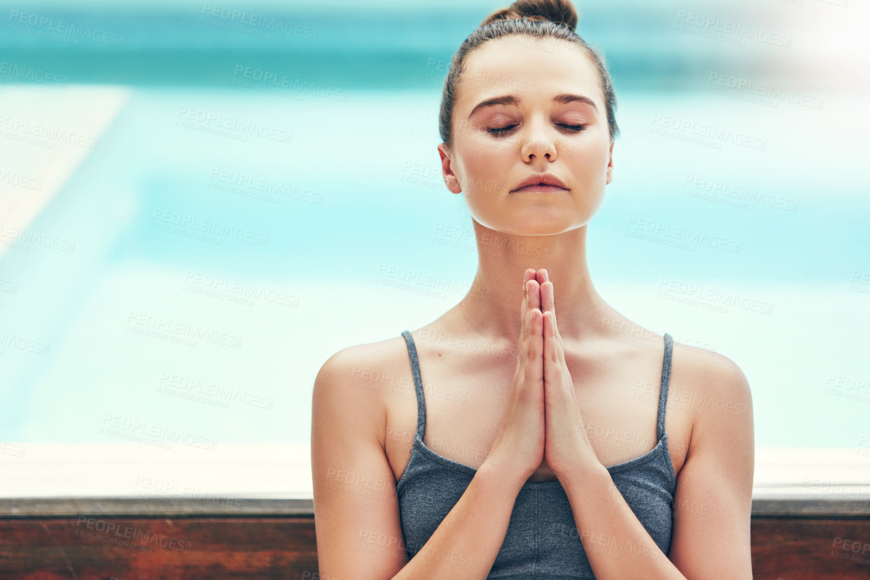 Buy stock photo Cropped shot of a beautiful young woman practicing yoga outside