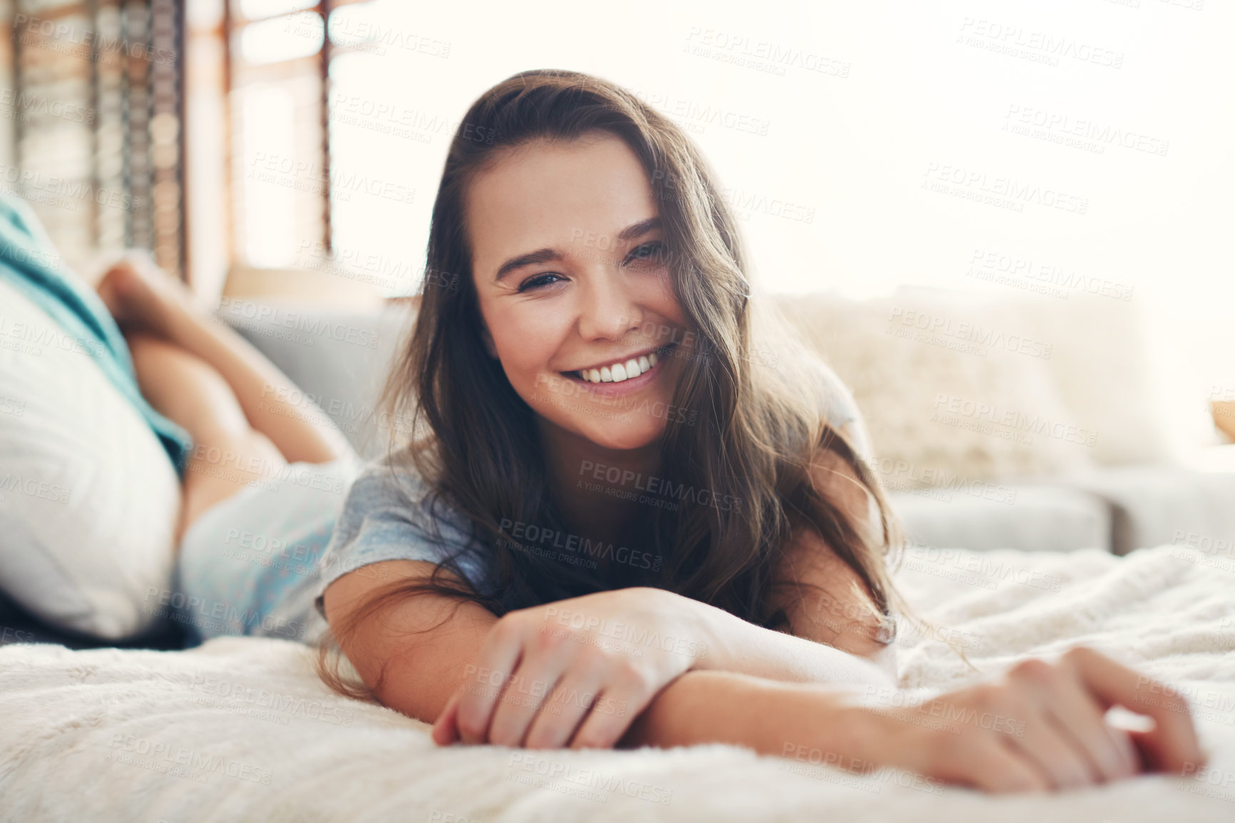 Buy stock photo Portrait of an attractive young woman spending a relaxing day on her bed at home