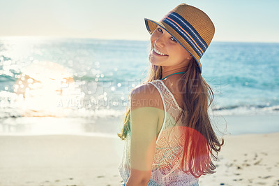 Buy stock photo Portrait of a beautiful young woman spending the day at the beach