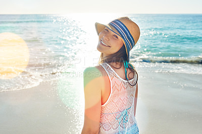 Buy stock photo Portrait of a beautiful young woman spending the day at the beach