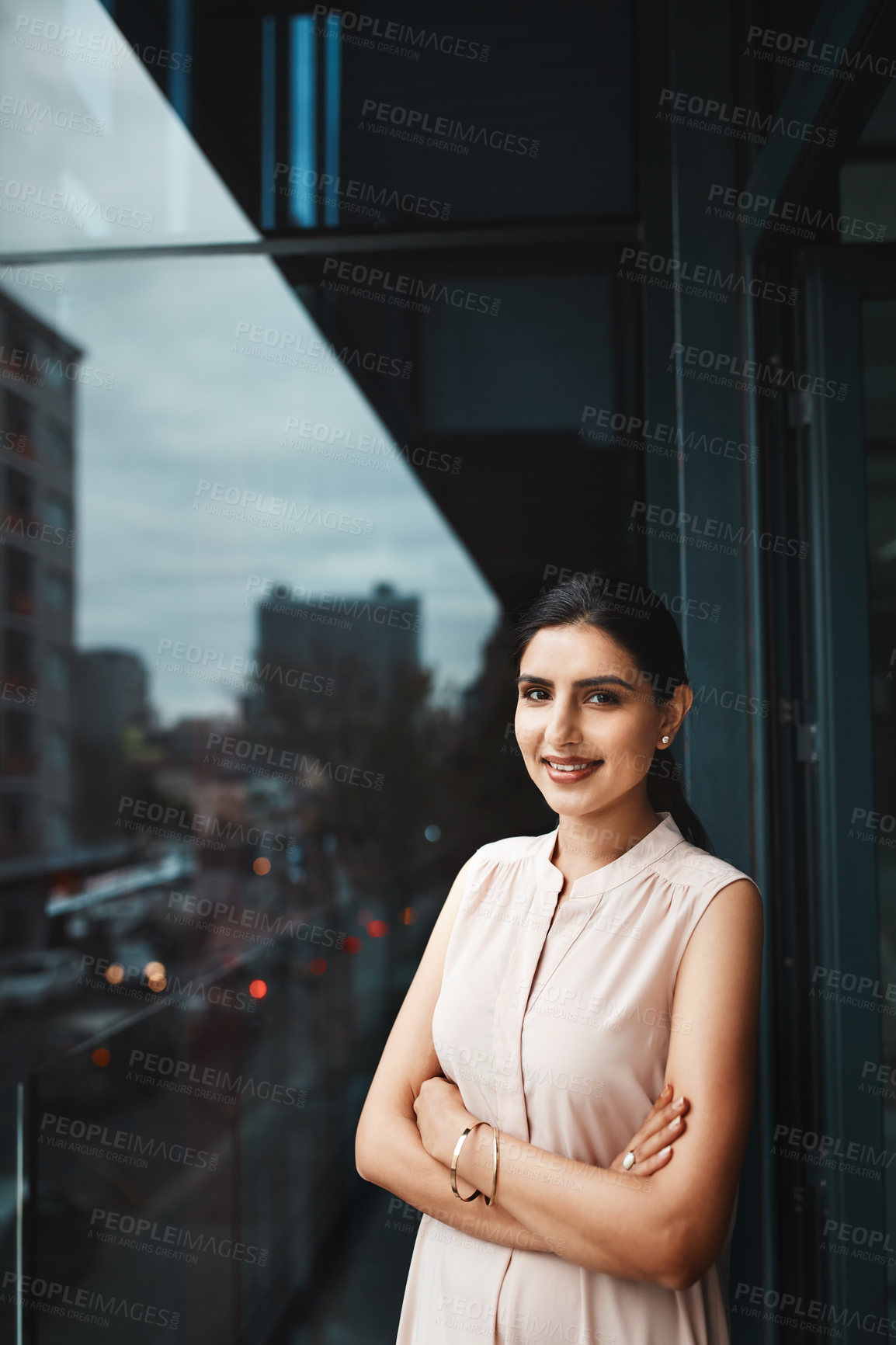 Buy stock photo Portrait of a young businesswoman standing on the office balcony