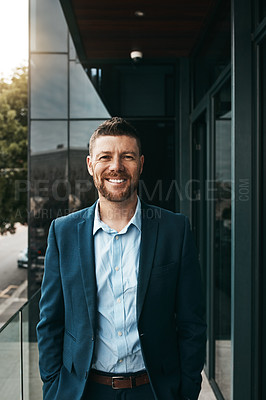 Buy stock photo Portrait of a mature businessman standing on the office balcony