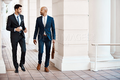 Buy stock photo Shot of young handsome businessmen talking outside