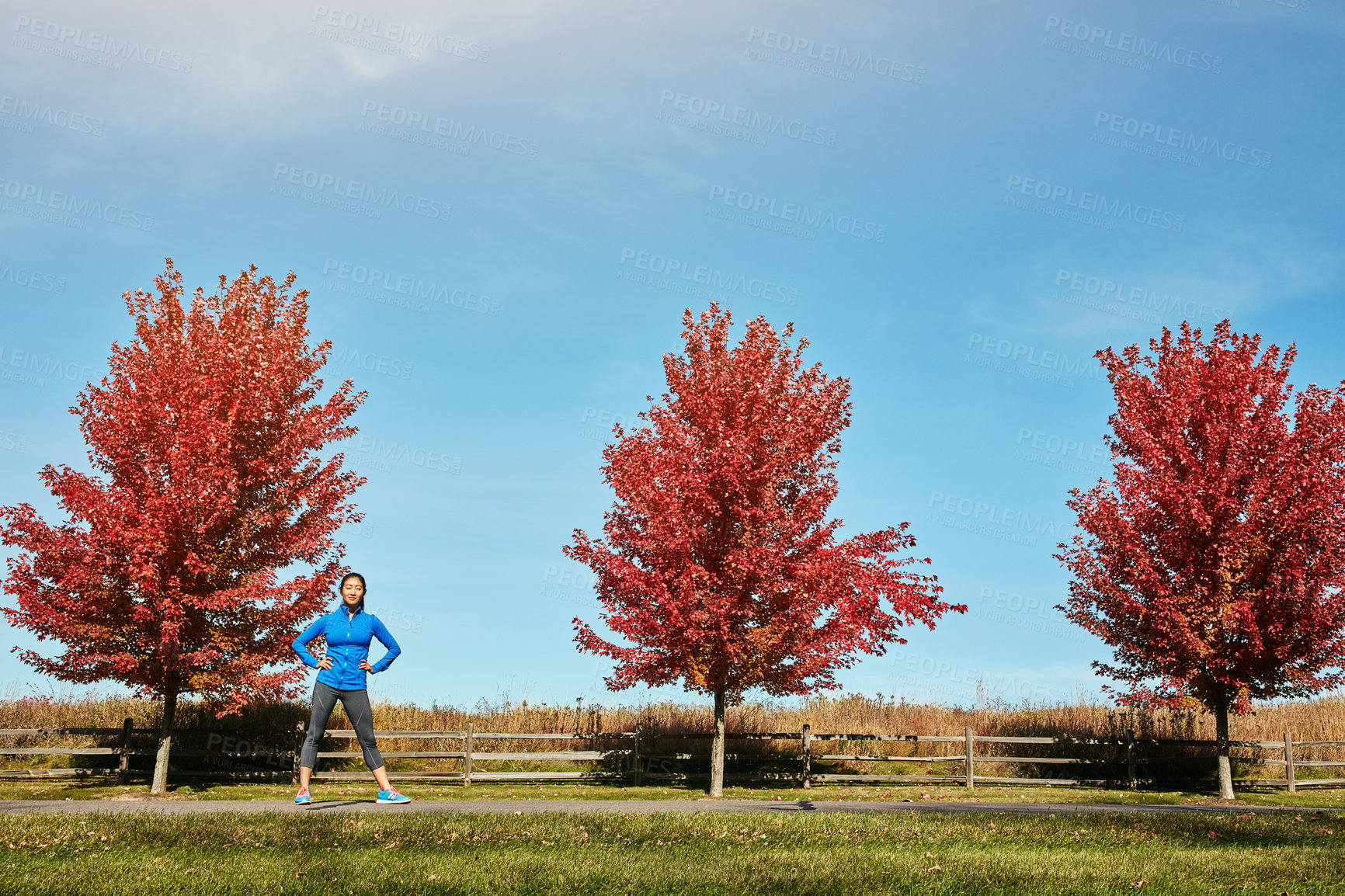 Buy stock photo Portrait of a sporty young woman standing outdoors
