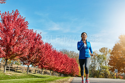 Buy stock photo Asian woman, running and wellness with training, exercise and challenge with endurance, nature and hobby. Healthy person, outdoor and runner with fitness, breathing and cardio with workout or routine