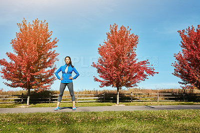 Buy stock photo Portrait of a sporty young woman standing outdoors