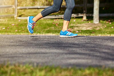 Buy stock photo Closeup shot of an unrecognizable woman running outdoors