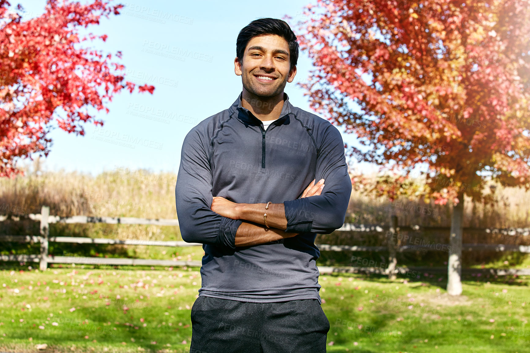 Buy stock photo Portrait of a sporty young man standing outdoors