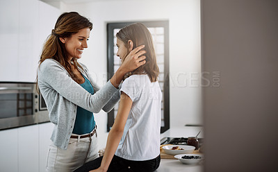 Buy stock photo Cropped shot of an attractive young woman and her daughter spending time together at home