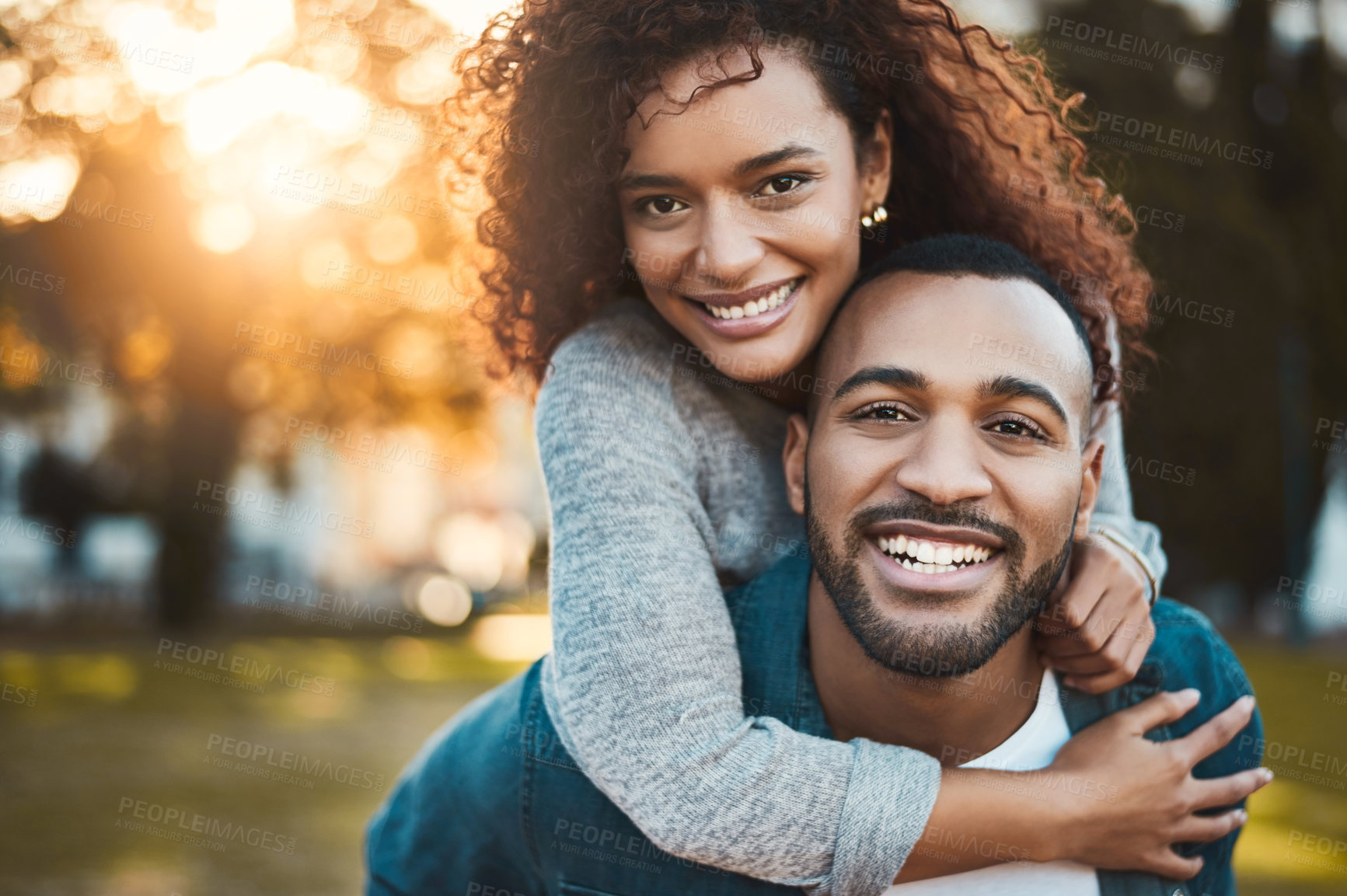 Buy stock photo Nature, piggyback and portrait of couple with love, care and bonding together in outdoor park. Smile, marriage and young man and woman embracing and having fun on date in field or garden in Mexico.