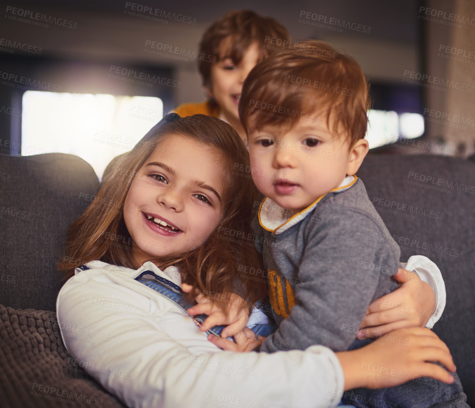 Buy stock photo Cropped portrait of an adorable little girl and her two brothers in their living room at home