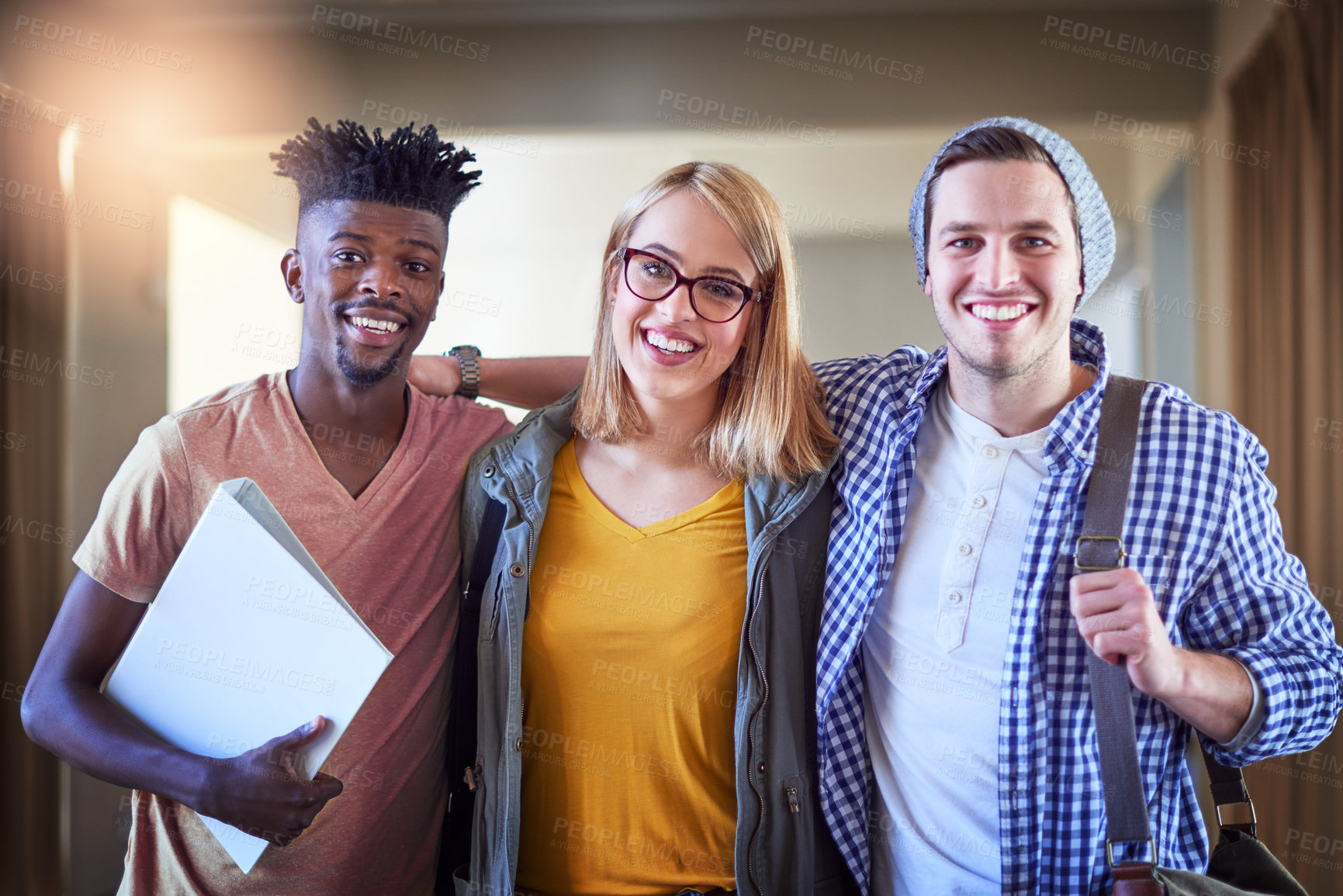 Buy stock photo Portrait of a group of university students standing in a corridor at campus