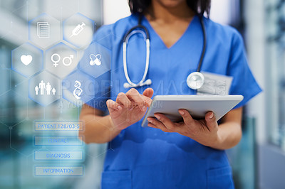 Buy stock photo Cropped shot of an unrecognizable female nurse using a tablet while standing in the hospital