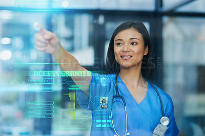 Buy stock photo Cropped shot of an attractive young female nurse using a touchscreen interface while standing in the hospital
