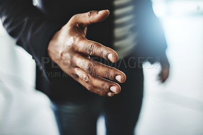 Buy stock photo Closeup shot of an unrecognizable businessman extending a handshake in an office