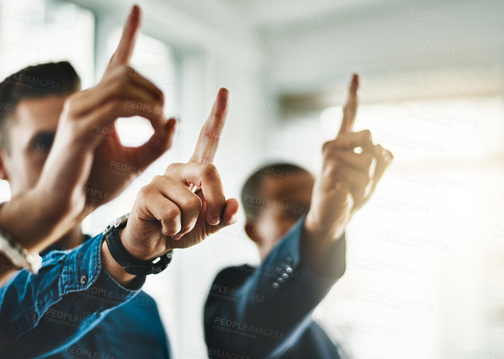 Buy stock photo Cropped shot of a group of businesspeople raising their hands in an office