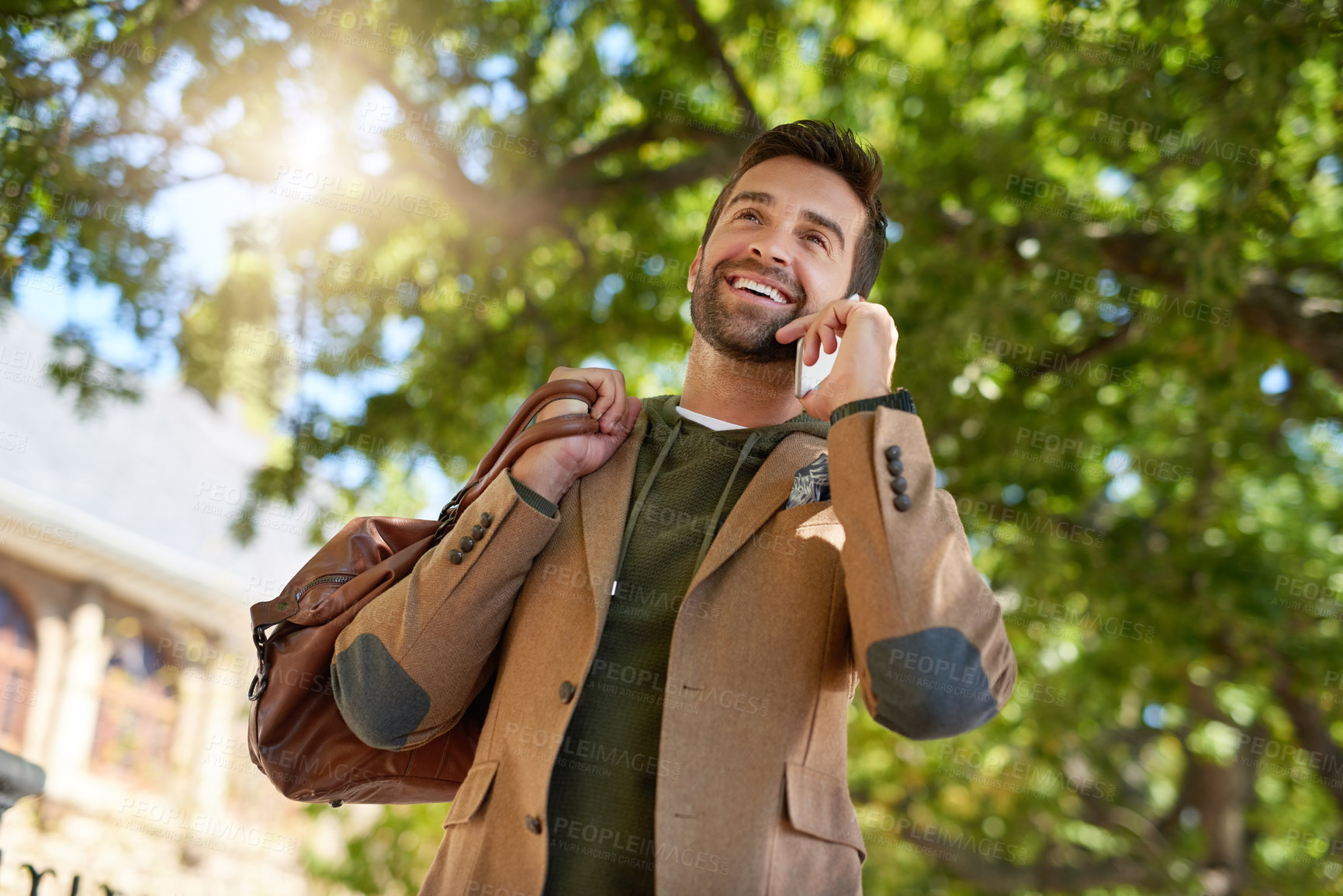 Buy stock photo Smile, travel and businessman with phone call in city for communication, networking and talking to client. Person, briefcase and discussion with technology in low angle for update on journey to work