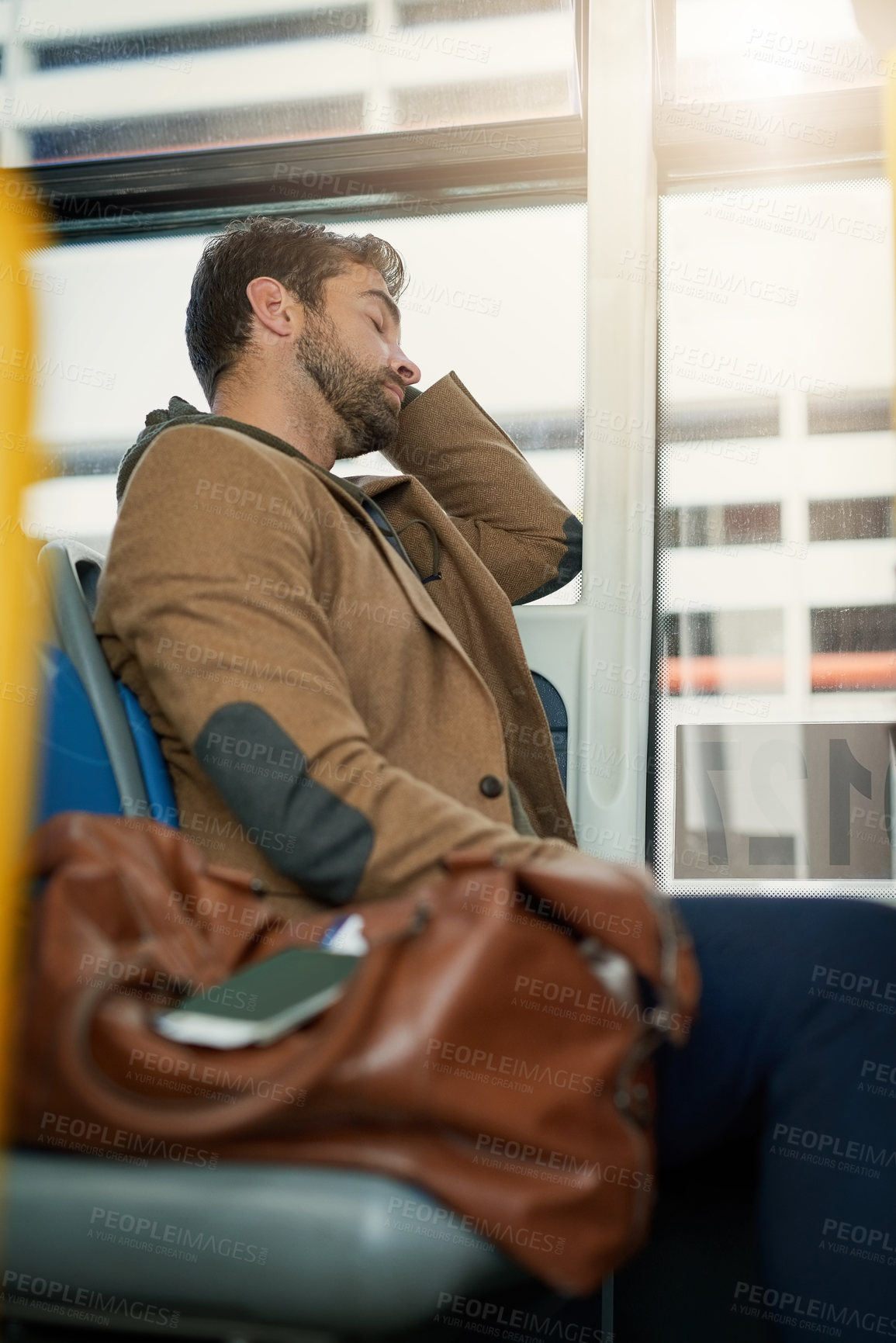 Buy stock photo Bus, travel and man by window sleeping for journey, commute and passenger in city. Public transport, station and person on vehicle exhausted, tired and asleep on trip in urban town, road and metro