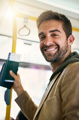 Buy stock photo Bus, travel and portrait of man in city for journey, commute and passenger downtown. Public transport, station and happy person on vehicle with book for ticket on trip in urban town, road and metro