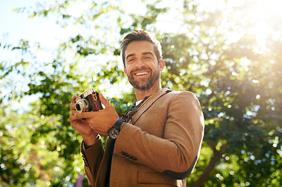 Buy stock photo Happy man, portrait and camera with nature for picture, sightseeing or travel in tourism at outdoor park. Young, male person and tourist or photographer with smile for memory or photography in woods