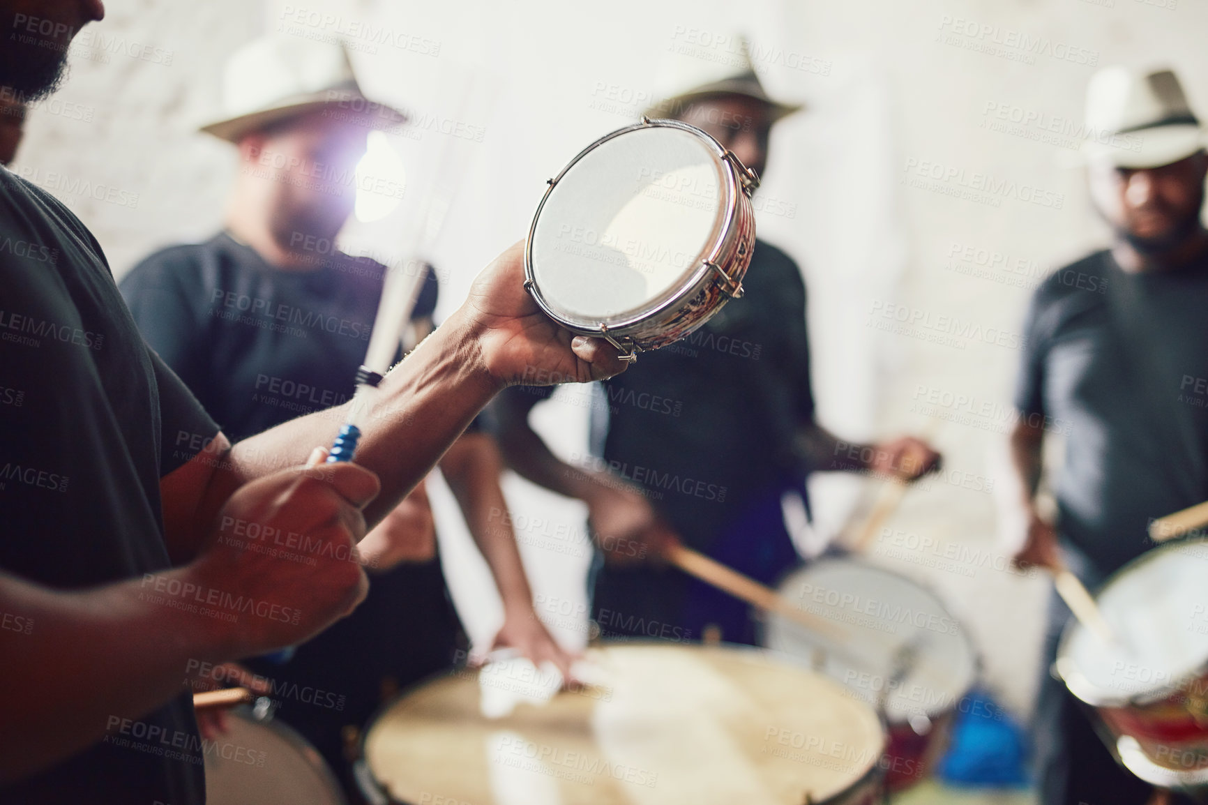 Buy stock photo Closeup shot of a musical performer playing drums with his band