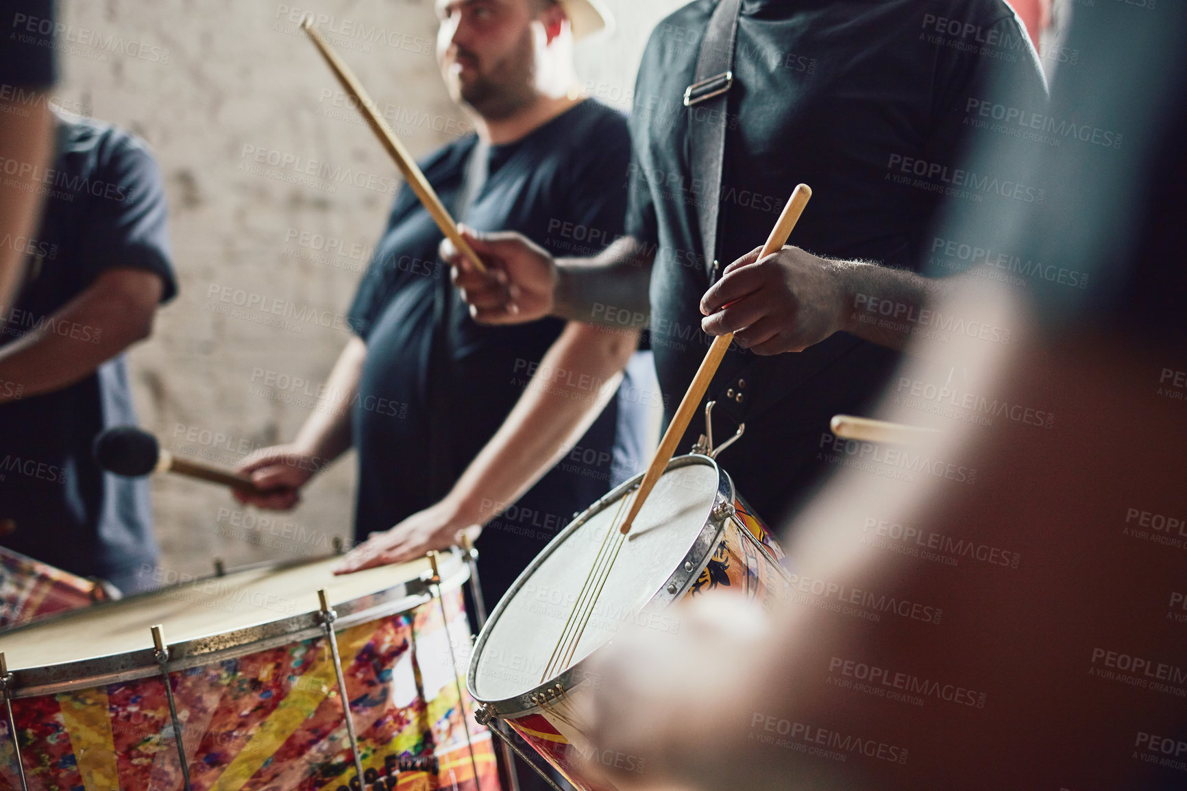 Buy stock photo Closeup shot of a musical performer playing drums with his band