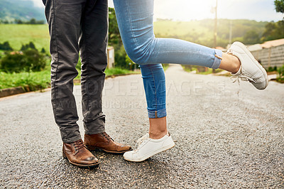 Buy stock photo Cropped shot of an unrecognizable couple standing outdoors