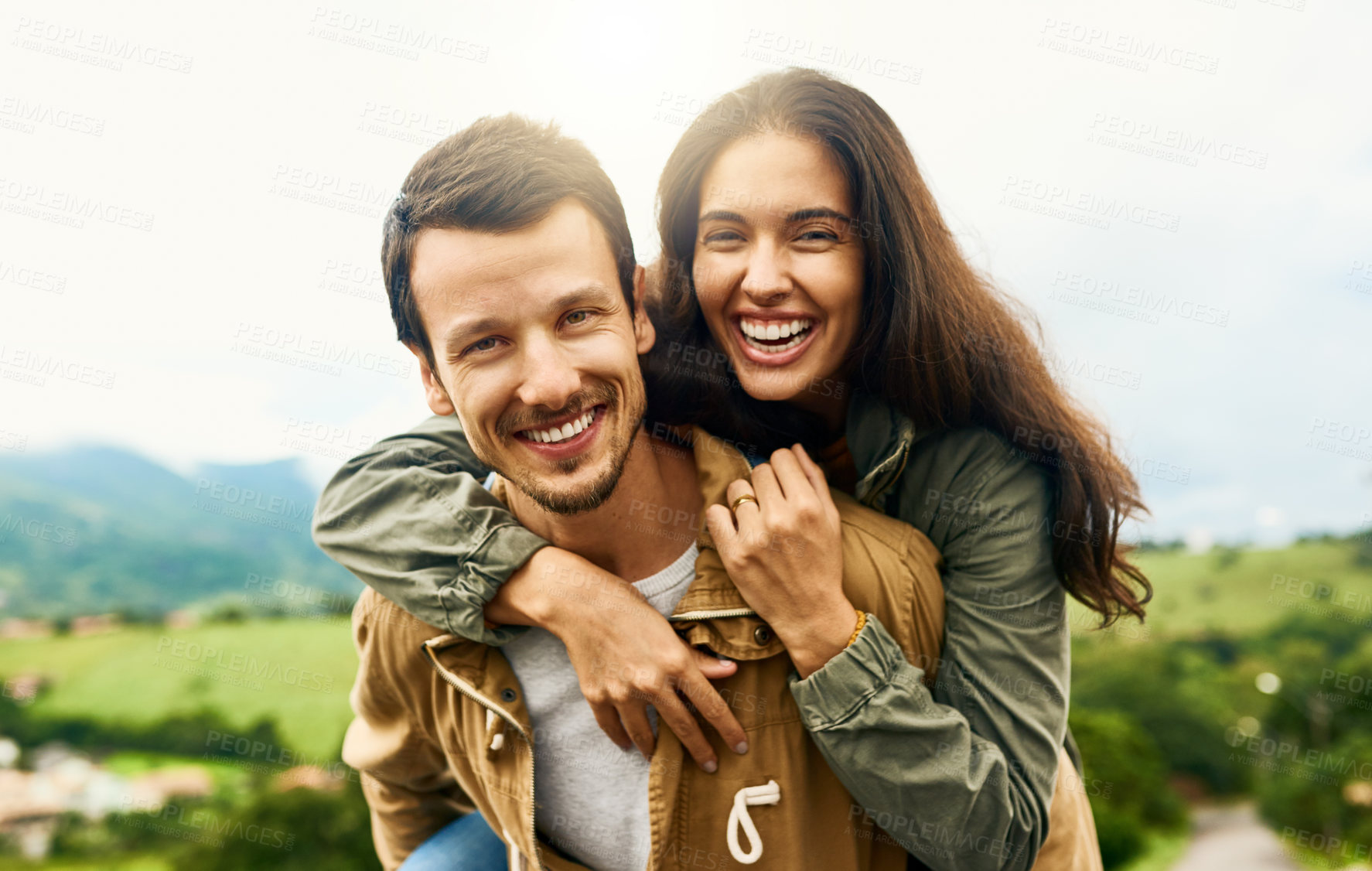 Buy stock photo Happy, love and piggyback with portrait of couple in nature for happy, smile and bonding. Happiness, relax and care with face of man carrying woman on countryside date for spring, vacation in Brazil