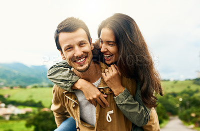 Buy stock photo Happy, love and piggyback with couple in nature for happy, smile and bonding. Happiness, relax and care with portrait of man carrying woman on countryside date for spring, vacation and support 