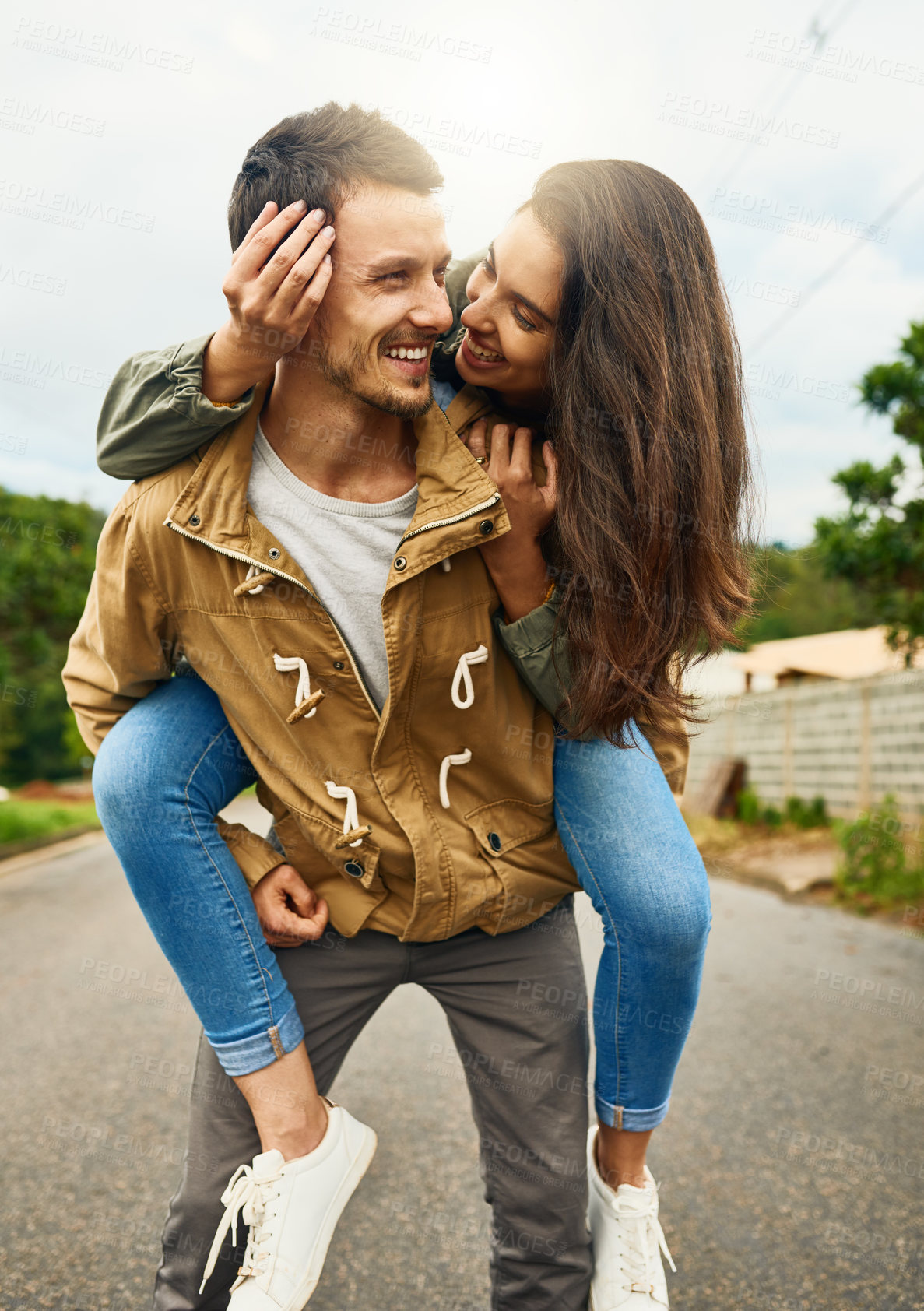 Buy stock photo Care, love and piggyback with couple in road for happy, smile and bonding. Happiness, relax and weekend with man carrying woman on countryside date for spring, anniversary vacation and support 