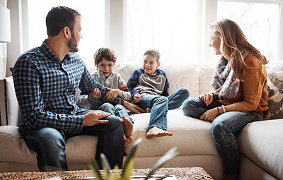Buy stock photo Family home, boy kids and parents on sofa with conversation, love or bonding for childhood development. Happy family, relax and sitting together in home living room for fun, happiness or quality time