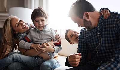 Buy stock photo Shot of two adorable little boys having fun with their parents at home