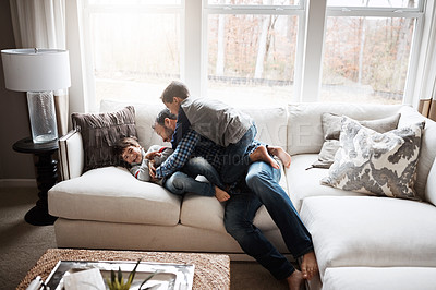 Buy stock photo Father, boy kids and playing on couch, fun and carefree with love, energy and happy at family home. Man play with children in living room, crazy and playful with happiness and excited with laughter