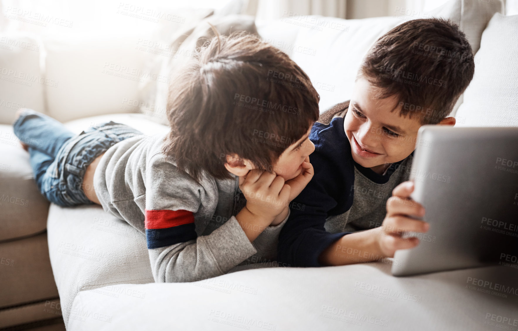 Buy stock photo Kids, bonding or digital tablet for movie streaming, social media or esports gaming on family home sofa. Smile, happy or children brothers on technology for education video, learning support or help