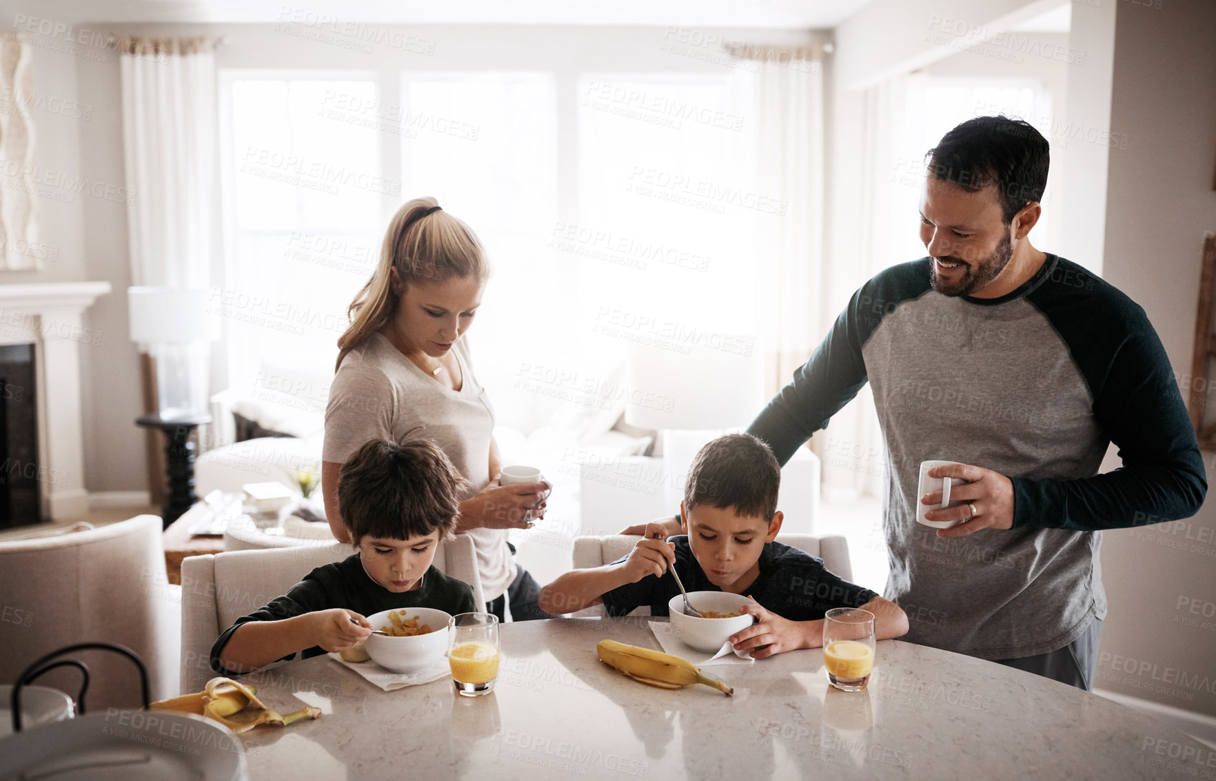 Buy stock photo Family home, boy children and breakfast with mom, dad and healthy start to morning for balance diet. Mother, father and kids at table with fruit, food or happy for bonding, love or nutrition wellness