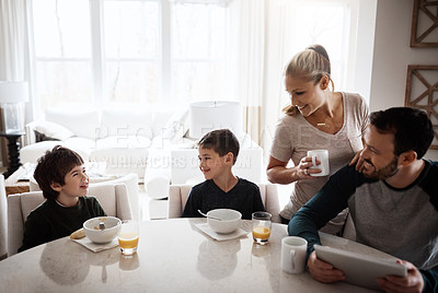 Buy stock photo Family, children and breakfast with a mother, father and boy siblings sitting around a table in the morning. Kids, love or bonding with a son, brother and parents enjoying a meal in the home together