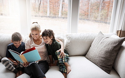 Buy stock photo Books, reading and mother with kids on sofa for storytelling time in living room of happy home. Love, learning and woman with children, book and fantasy story on couch, growth and child development.