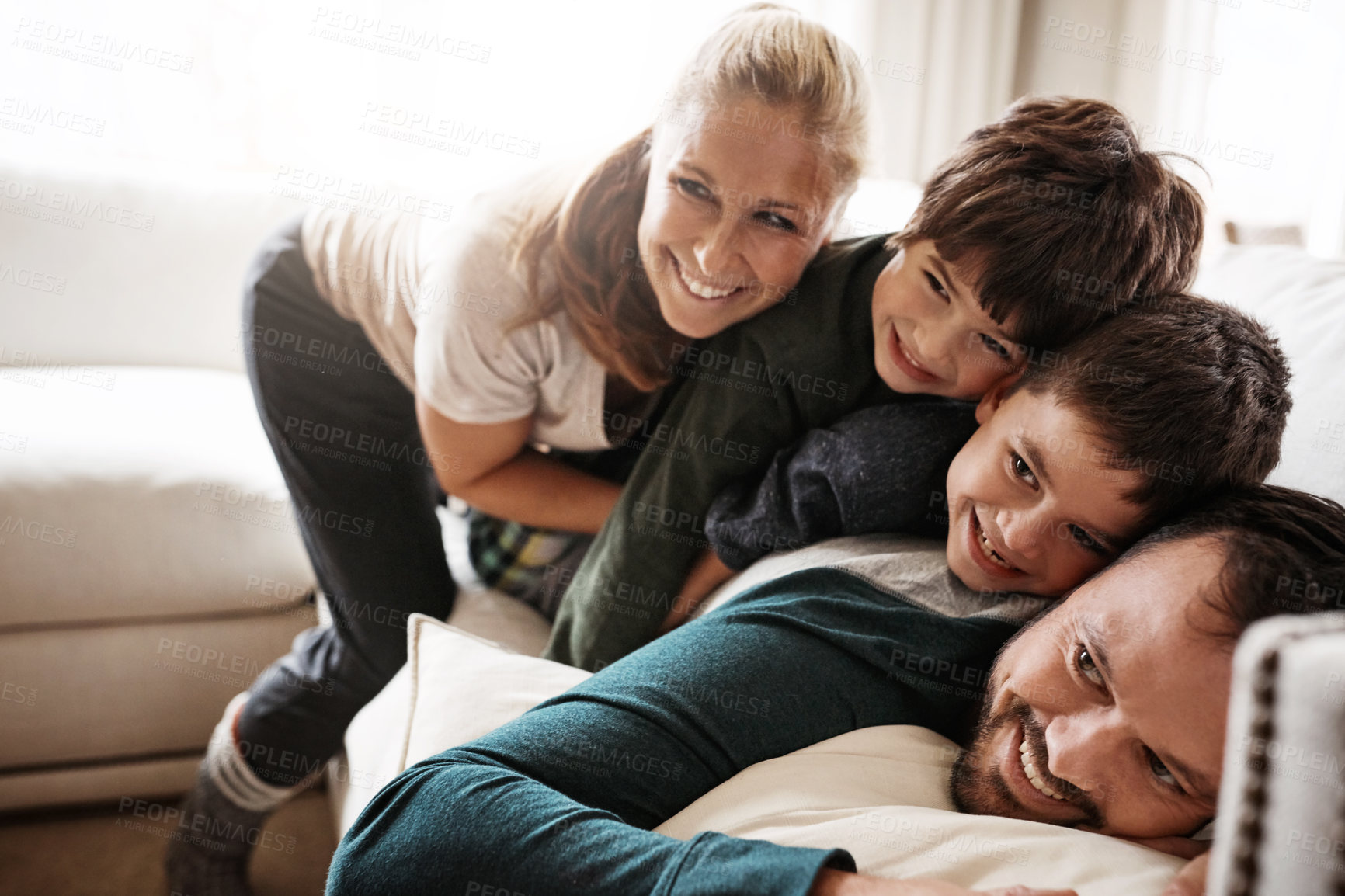 Buy stock photo Shot of a happy family having fun together at home