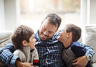 Buy stock photo Family home, boys and dad with hug on sofa for conversation, love or bonding for childhood development. Happy people, relax or joke together in living room for fun, happiness or quality time in house