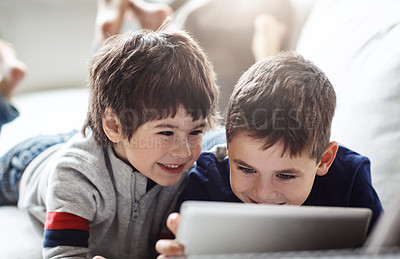 Buy stock photo Happy children, bonding or tablet on relax house sofa in home living room on brothers esports, social media or movies. Smile, fun or kids streaming on digital technology in team education or learning