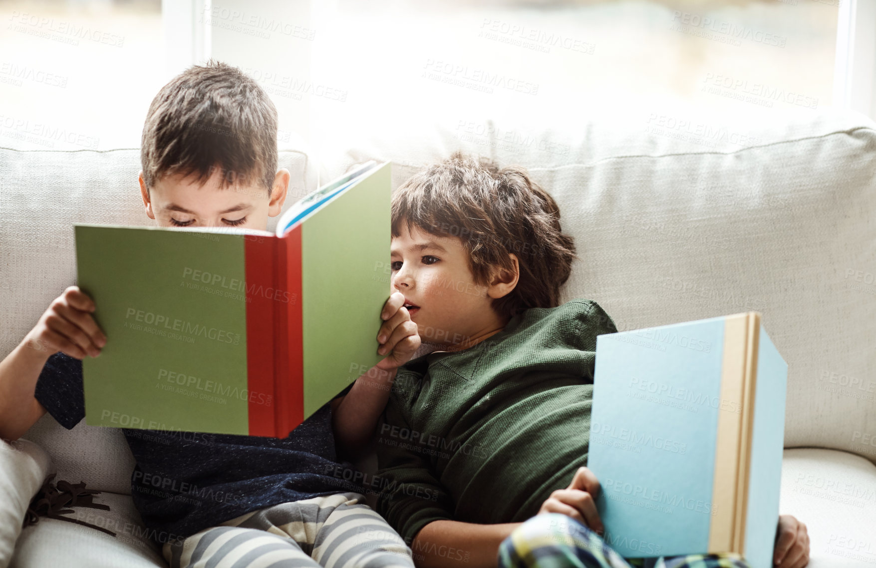 Buy stock photo Boys, kids and books for reading on couch, literature and english development for sibling bonding in home. Children, brothers and story in living room for knowledge, learning and literacy growth