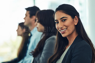 Buy stock photo Portrait of a confident young businesswoman attending a conference in a modern office