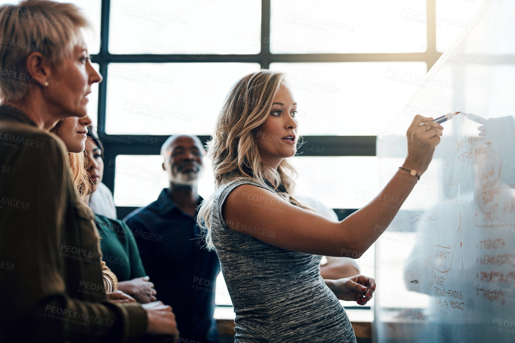 Buy stock photo Shot of a pregnant businesswoman giving a presentation in the boardroom