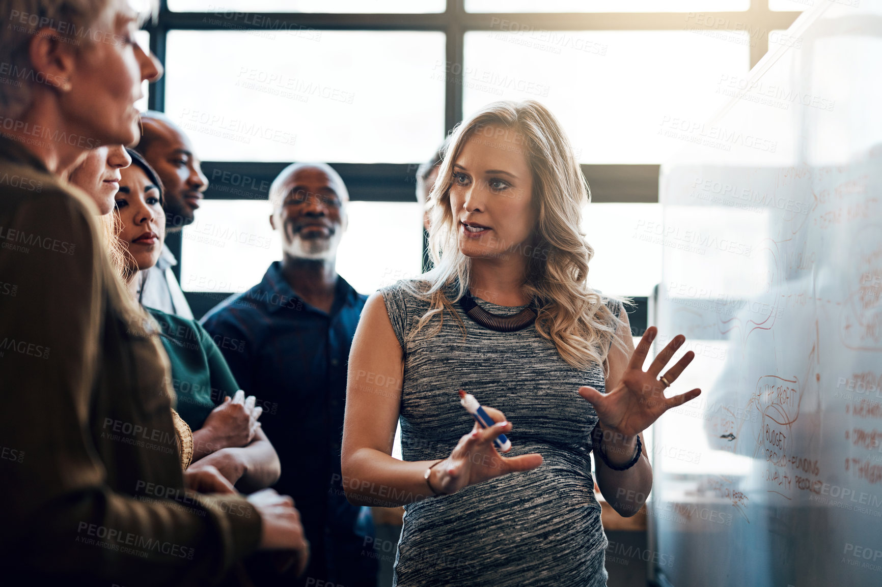 Buy stock photo Shot of a pregnant businesswoman giving a presentation in the boardroom