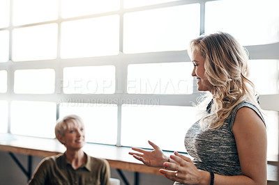 Buy stock photo Shot of a pregnant businesswoman giving a presentation in the boardroom