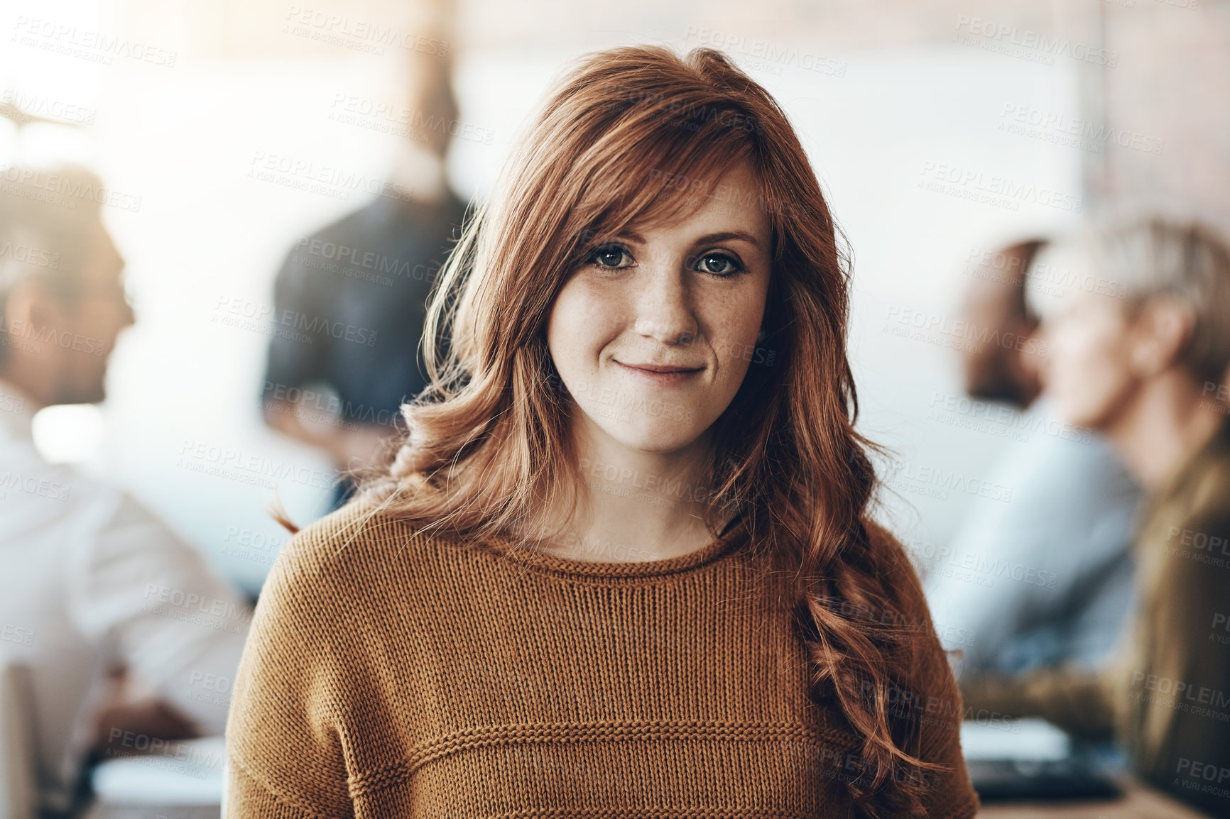 Buy stock photo Business, portrait of businesswoman happy and meeting in office at work with coworkers in background. Entrepreneur or creative, lens flare and smiling female worker sitting at workplace in boardroom